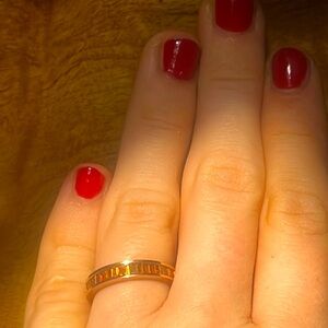 10k rose gold ring with baguette cut orange garnets. Beautiful!